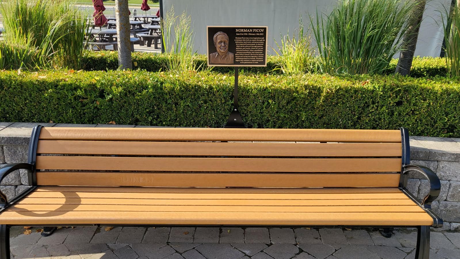 Outdoor bench and memorial plaque