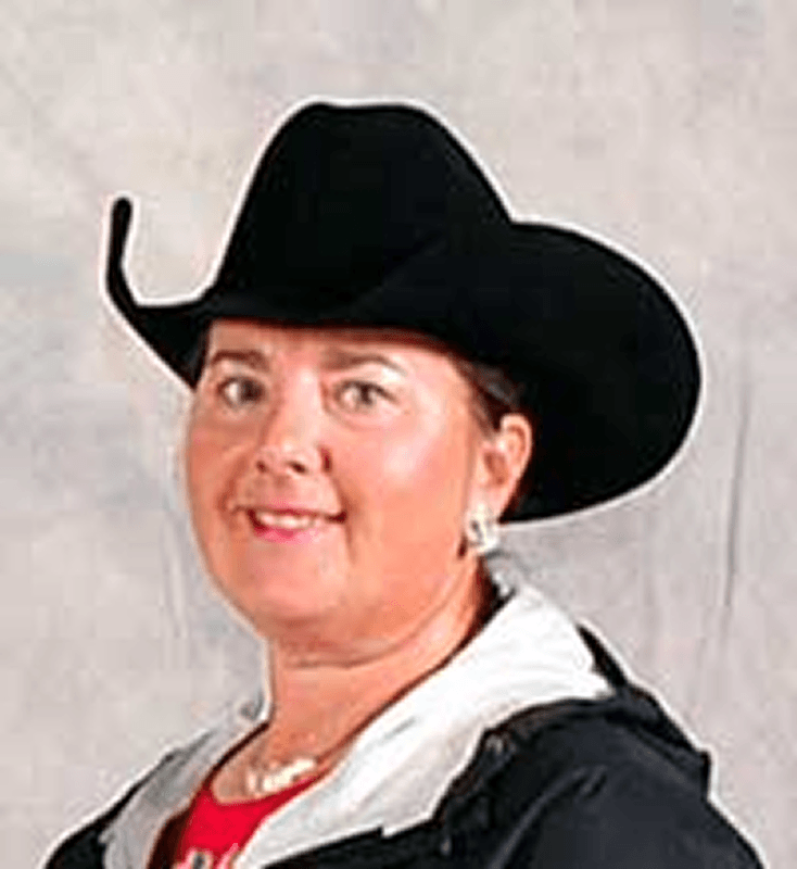 Portrait of smiling woman wearing western hat