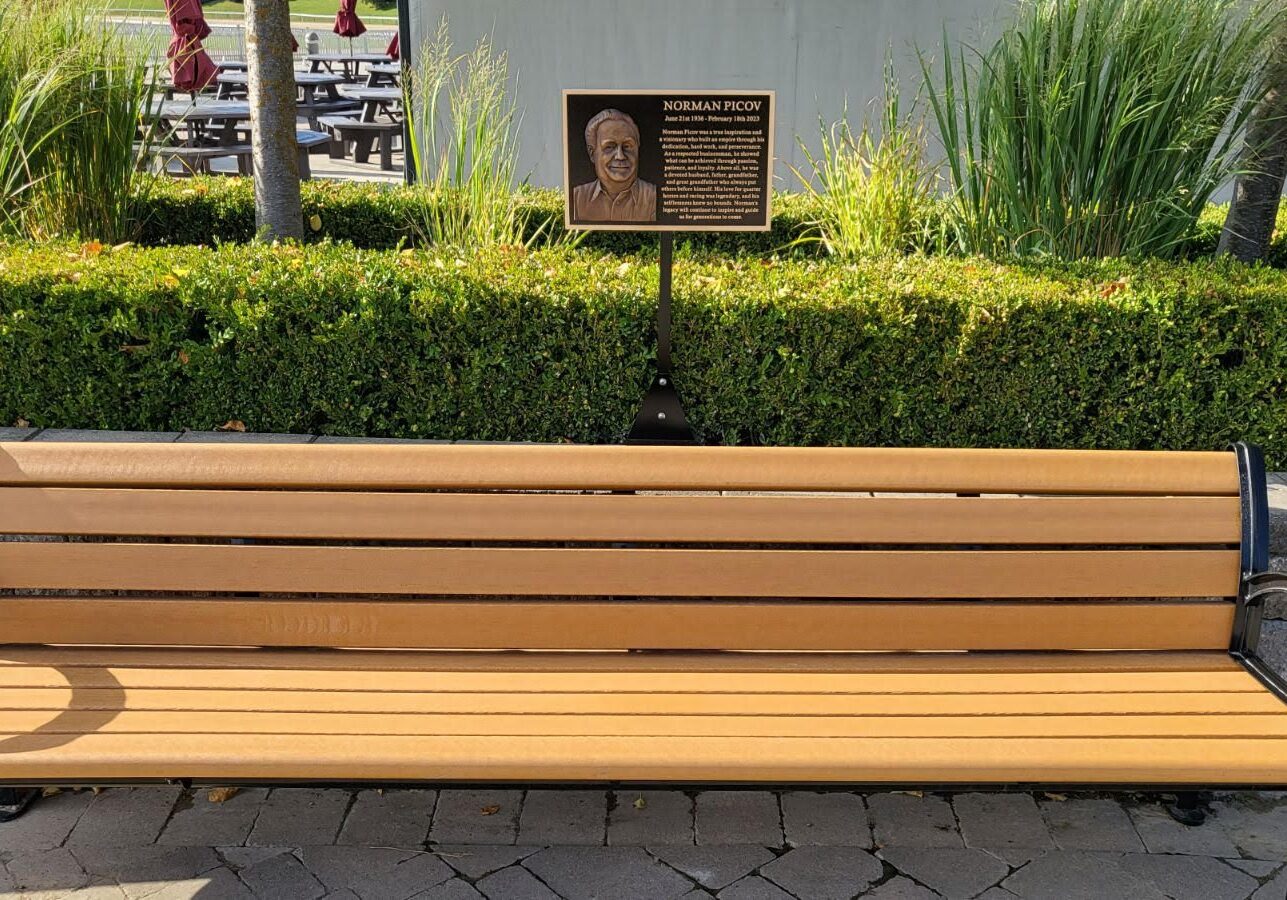 Outdoor bench and memorial plaque